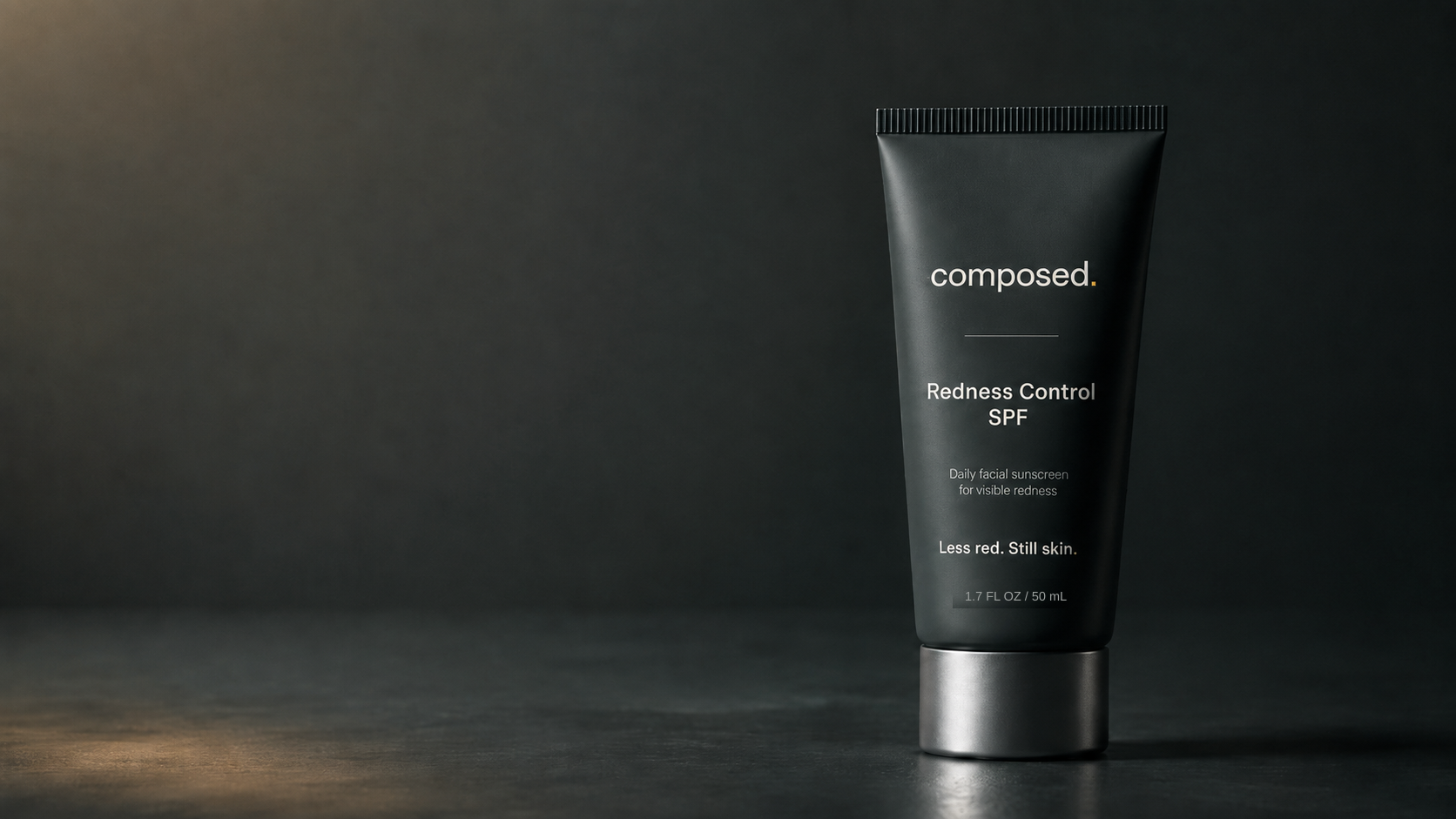 Composed Redness Control SPF tube on a dark surface
